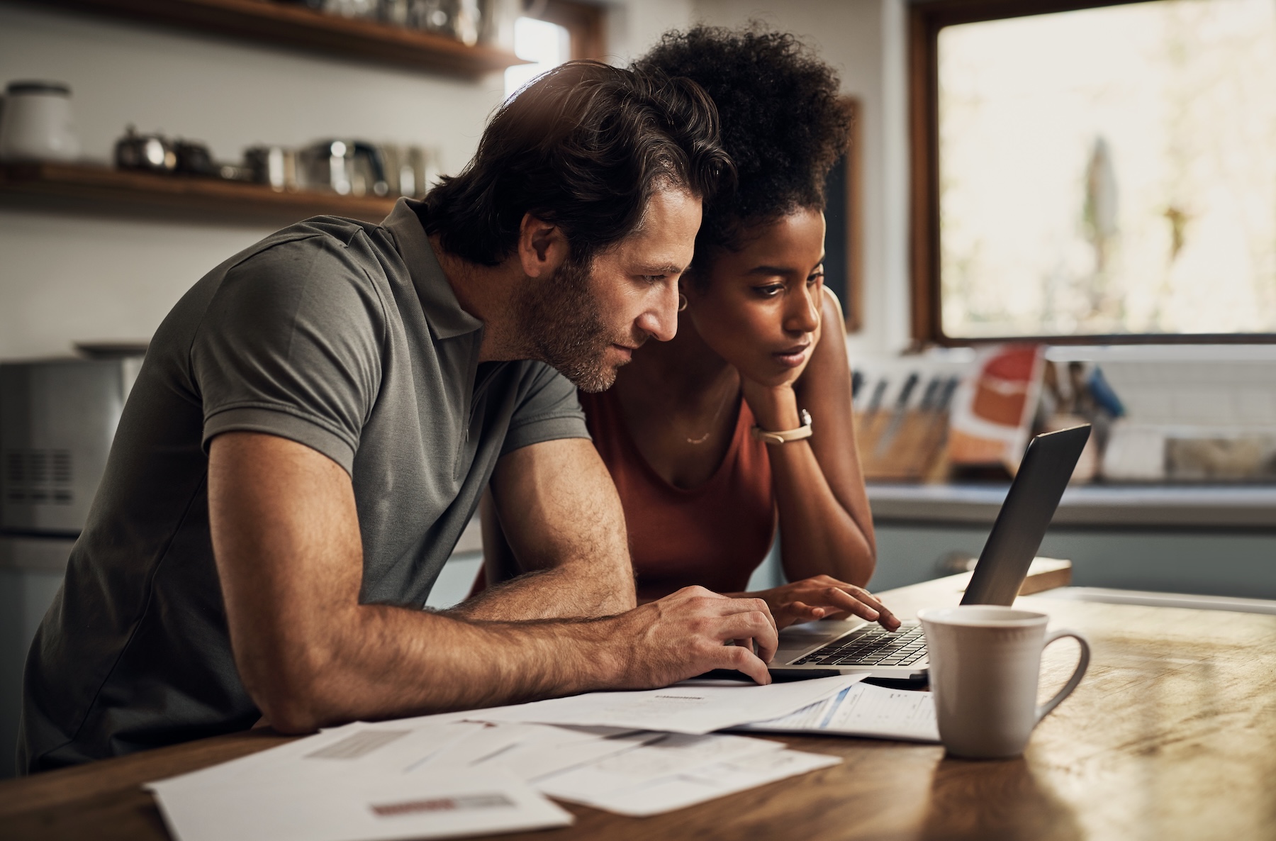 Couple with a laptop doing insurance paper work