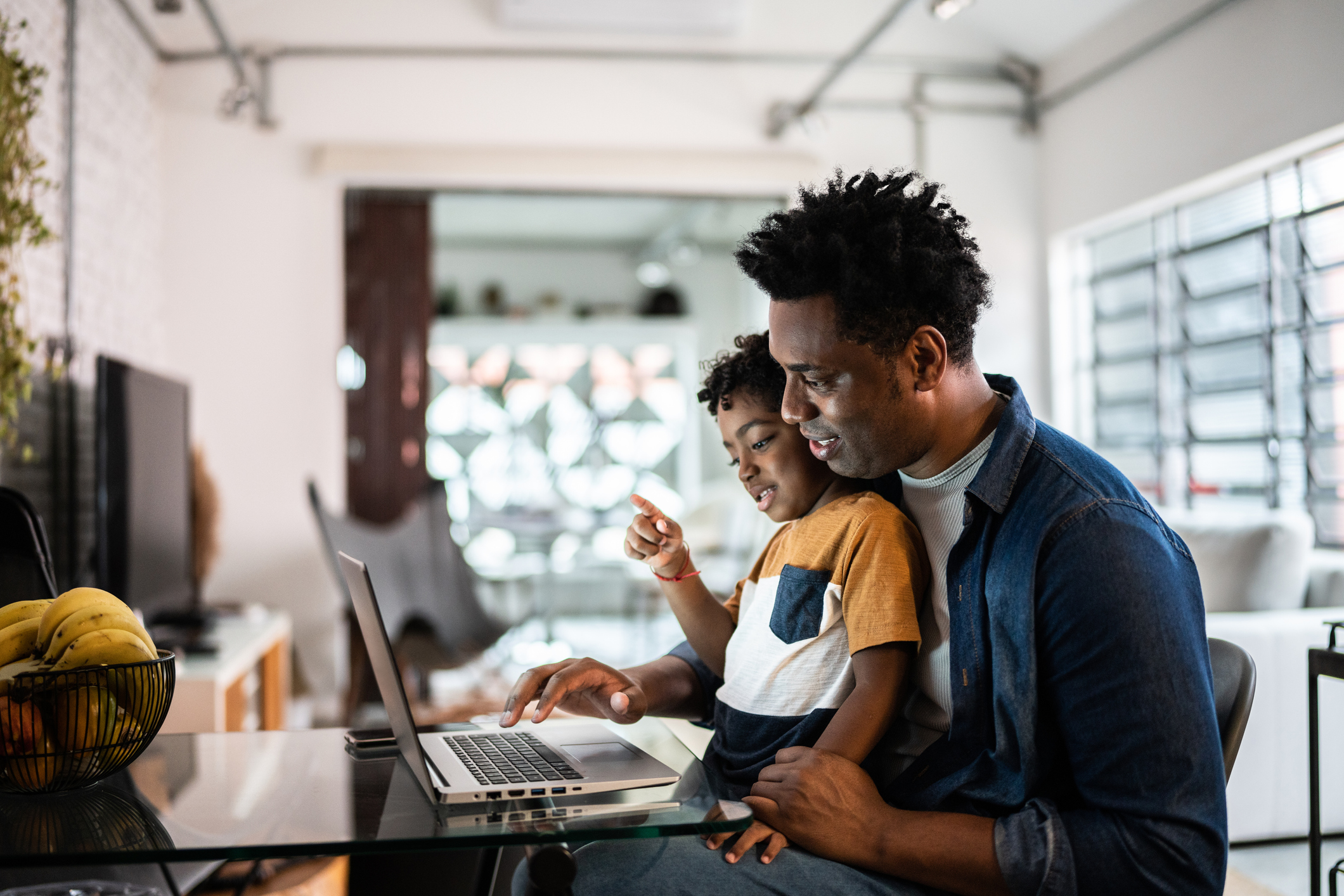 Father and son using Internet from a service provider in Gonzales
